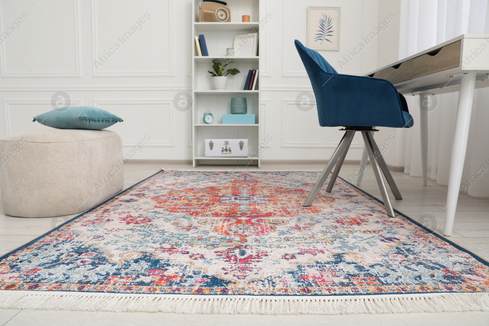 Photo of Stylish room with beautiful rug and furniture. Interior design