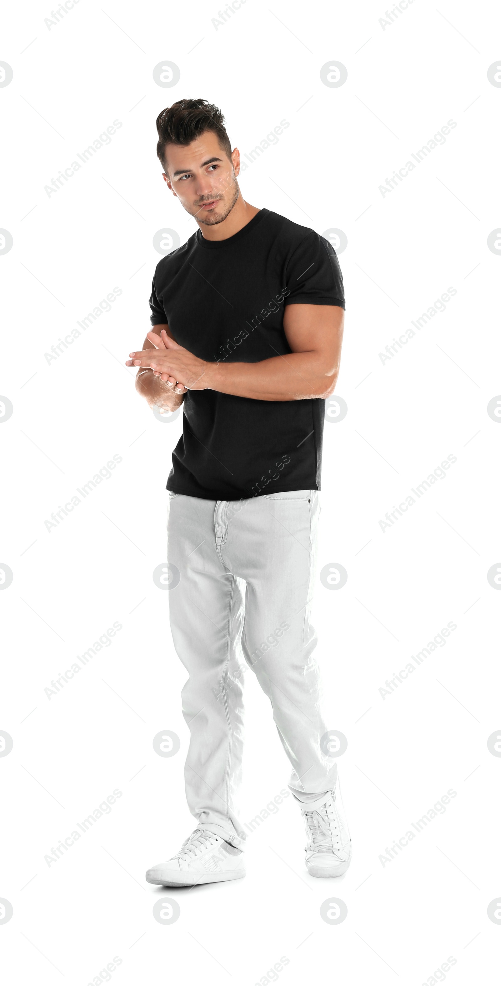 Photo of Young man in stylish jeans on white background