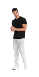 Young man in stylish jeans on white background