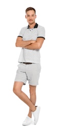 Young man in casual clothes posing on white background