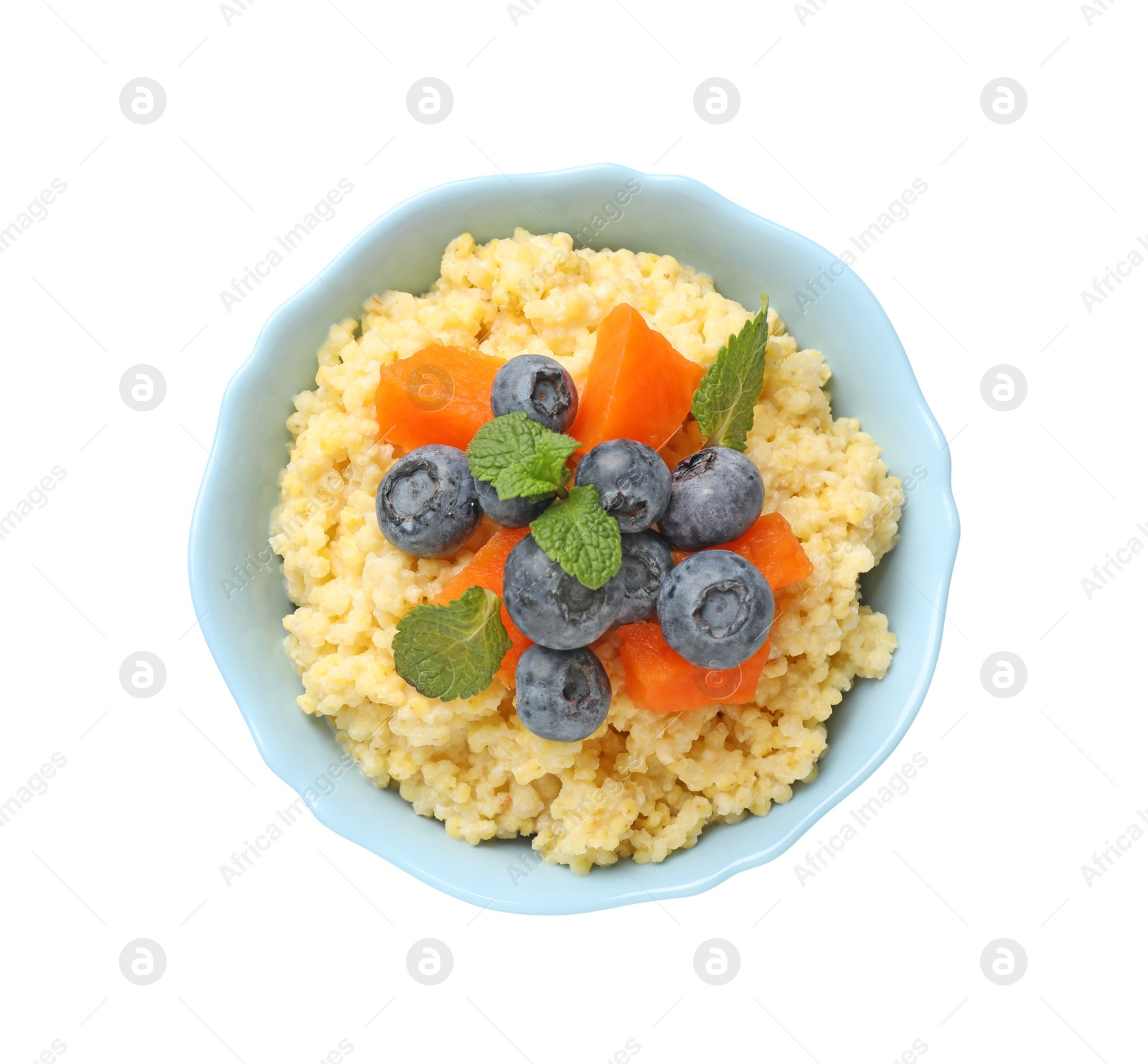 Photo of Tasty millet porridge with blueberries, pumpkin and mint in bowl isolated on white, top view