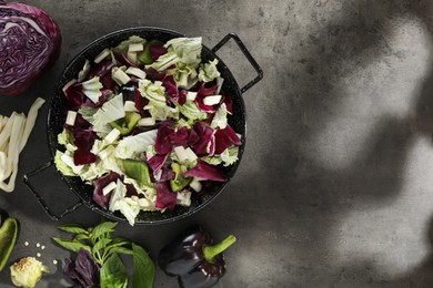 Photo of Delicious salad with Chinese cabbage, suluguni cheese and bell pepper on grey table, flat lay. Space for text