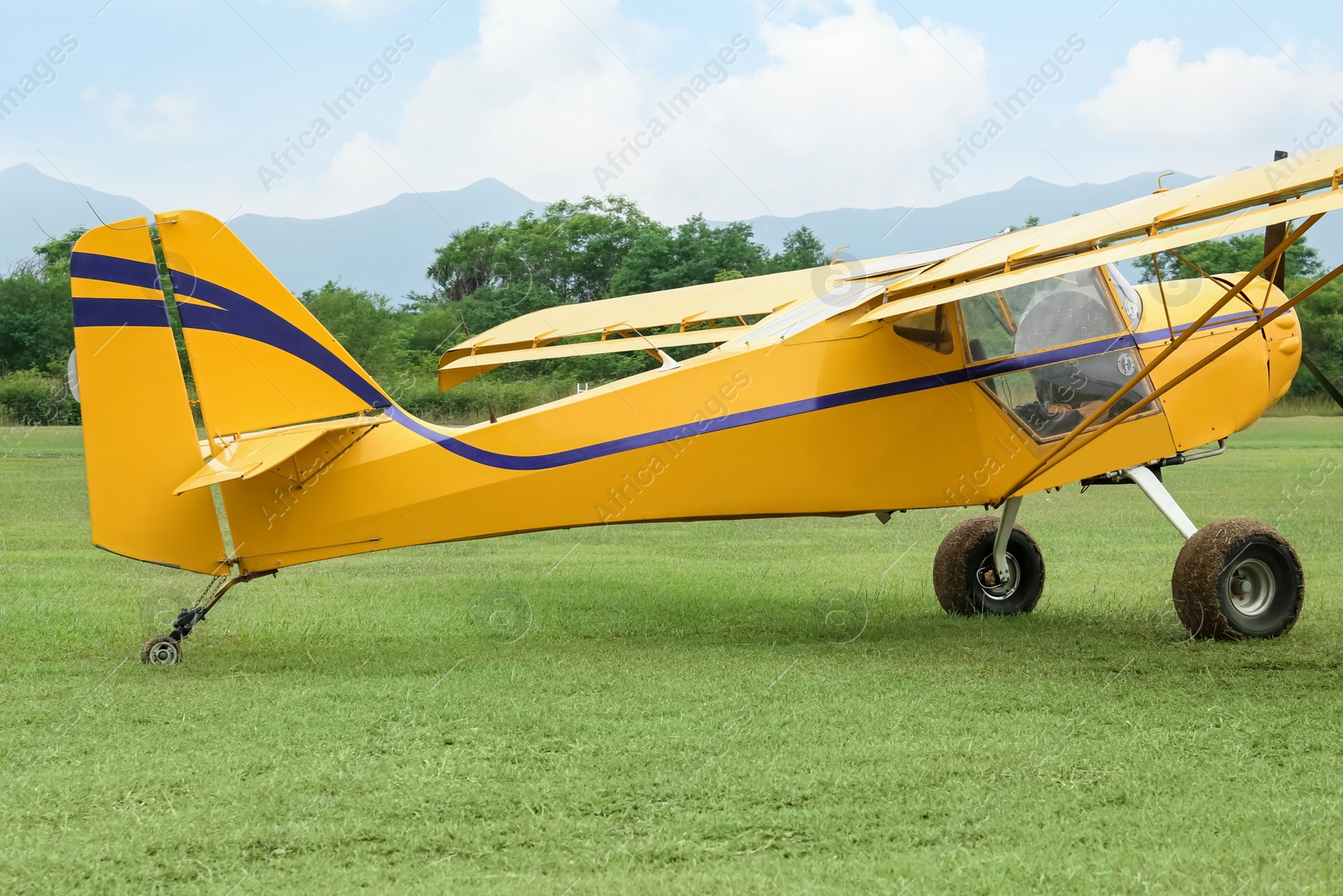 Photo of View of beautiful ultralight airplane in field on autumn day