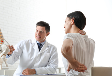 Photo of Young woman visiting orthopedist in medical office