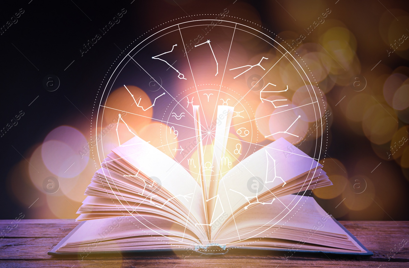 Image of Open book on wooden table and illustration of zodiac wheel with astrological signs