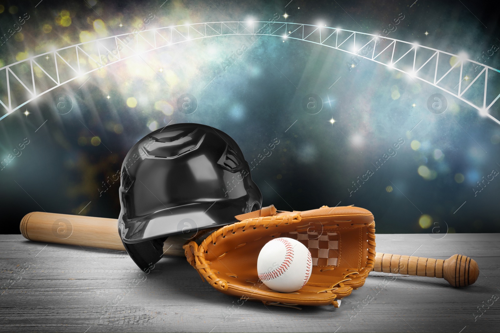 Image of Baseball bat, glove, helmet and ball on wooden table at stadium