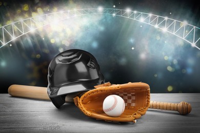 Image of Baseball bat, glove, helmet and ball on wooden table at stadium