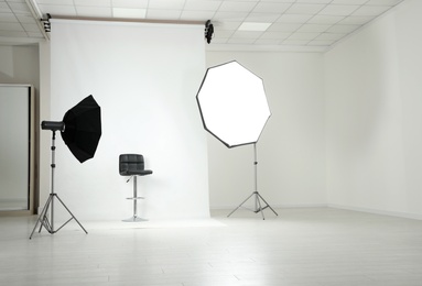 Photo studio interior with set of professional equipment