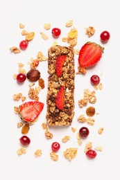 Photo of Tasty granola bar and ingredients isolated on white, top view