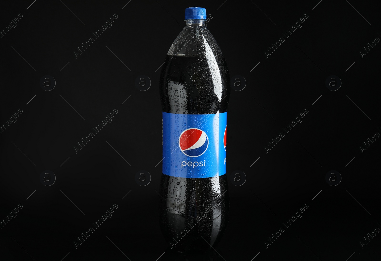 Photo of MYKOLAIV, UKRAINE - FEBRUARY 9, 2021: Bottle of Pepsi on black background
