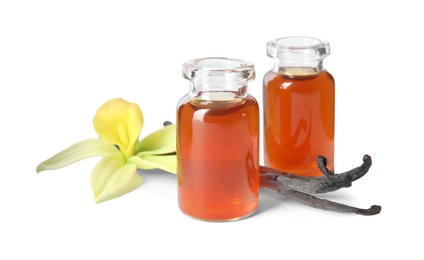 Photo of Vanilla extract, flower and dry pods isolated on white