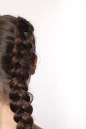Woman with braided hair on white background, closeup. Space for text