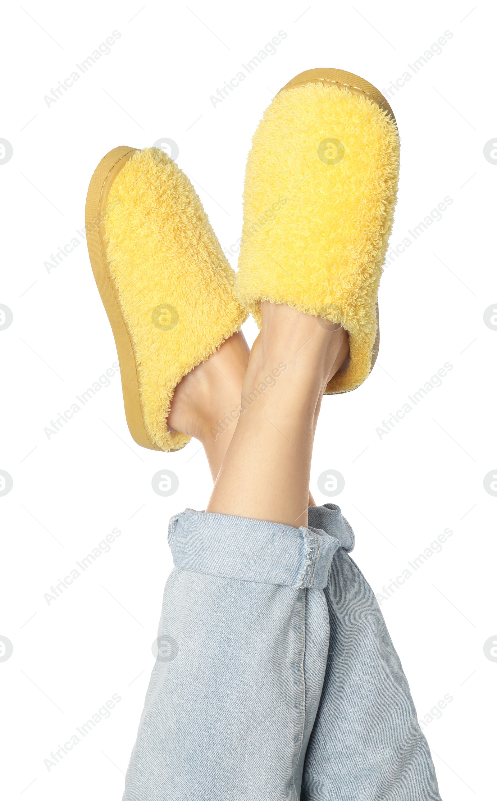 Photo of Woman in yellow soft slippers on white background, closeup