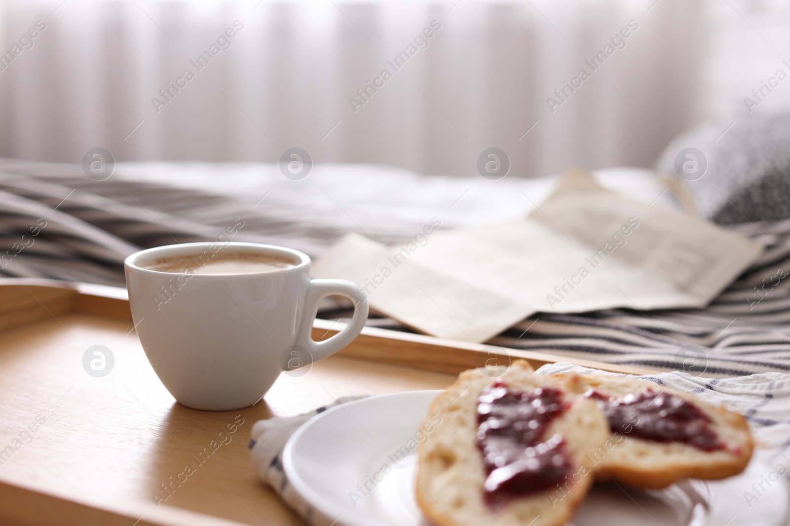 Photo of Morning coffee and sandwiches on tray in bedroom. Space for text