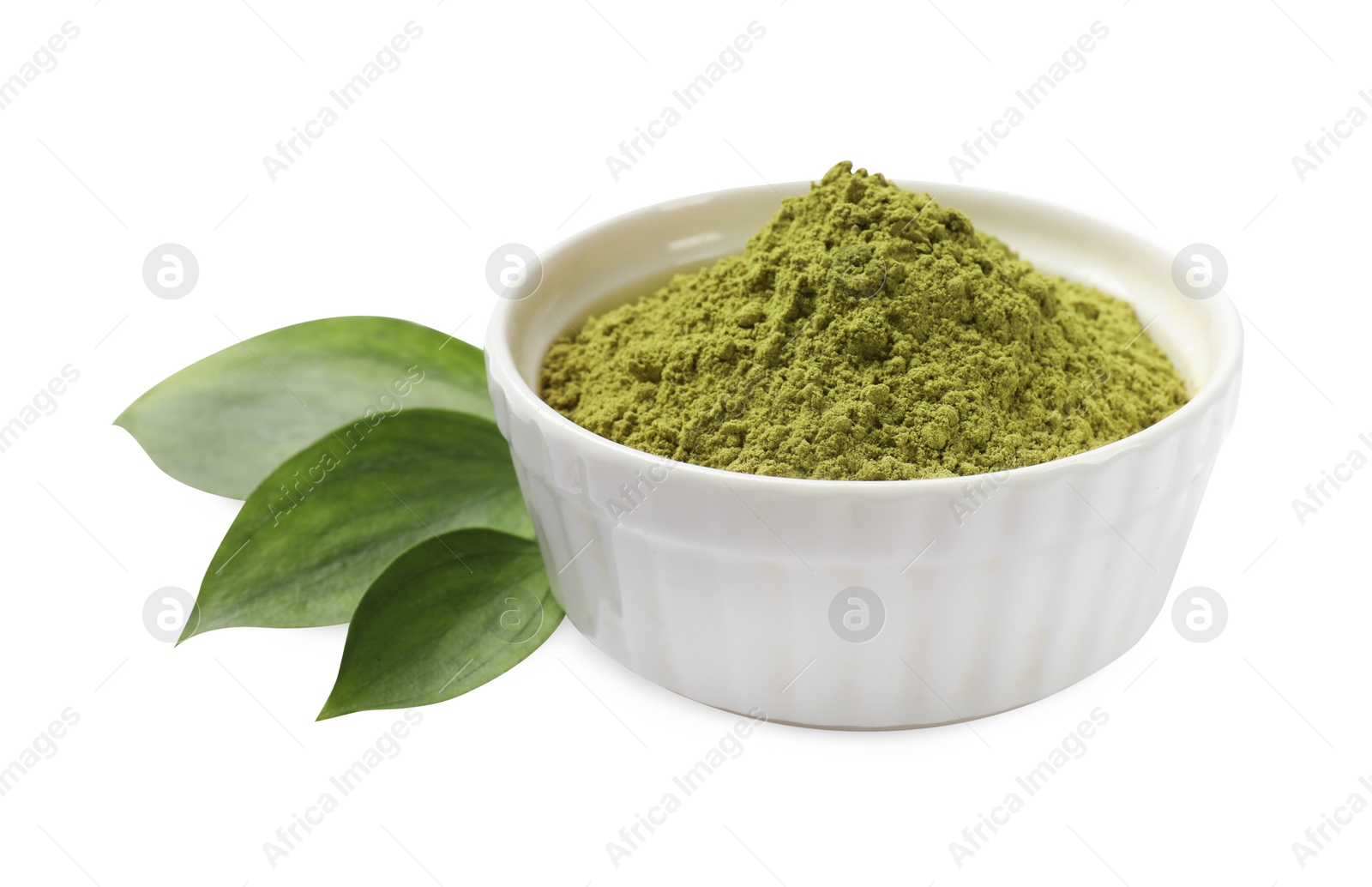 Photo of Henna powder in bowl and green leaves isolated on white