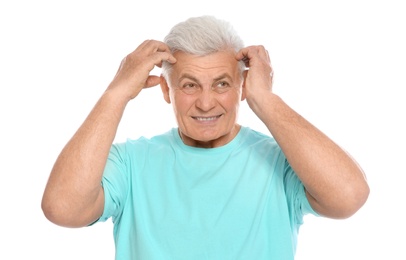 Photo of Mature man scratching head on white background. Annoying itch