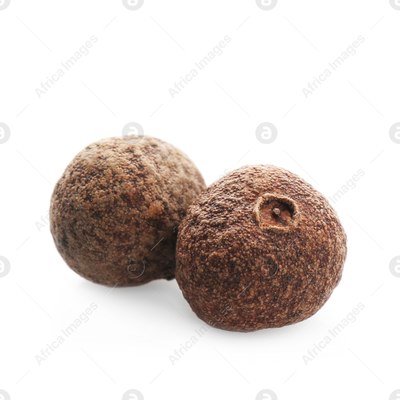 Photo of Allspice pepper grains on white background. Natural spice