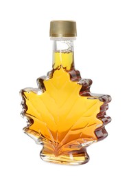 Photo of Leaf shaped bottle of tasty maple syrup isolated on white