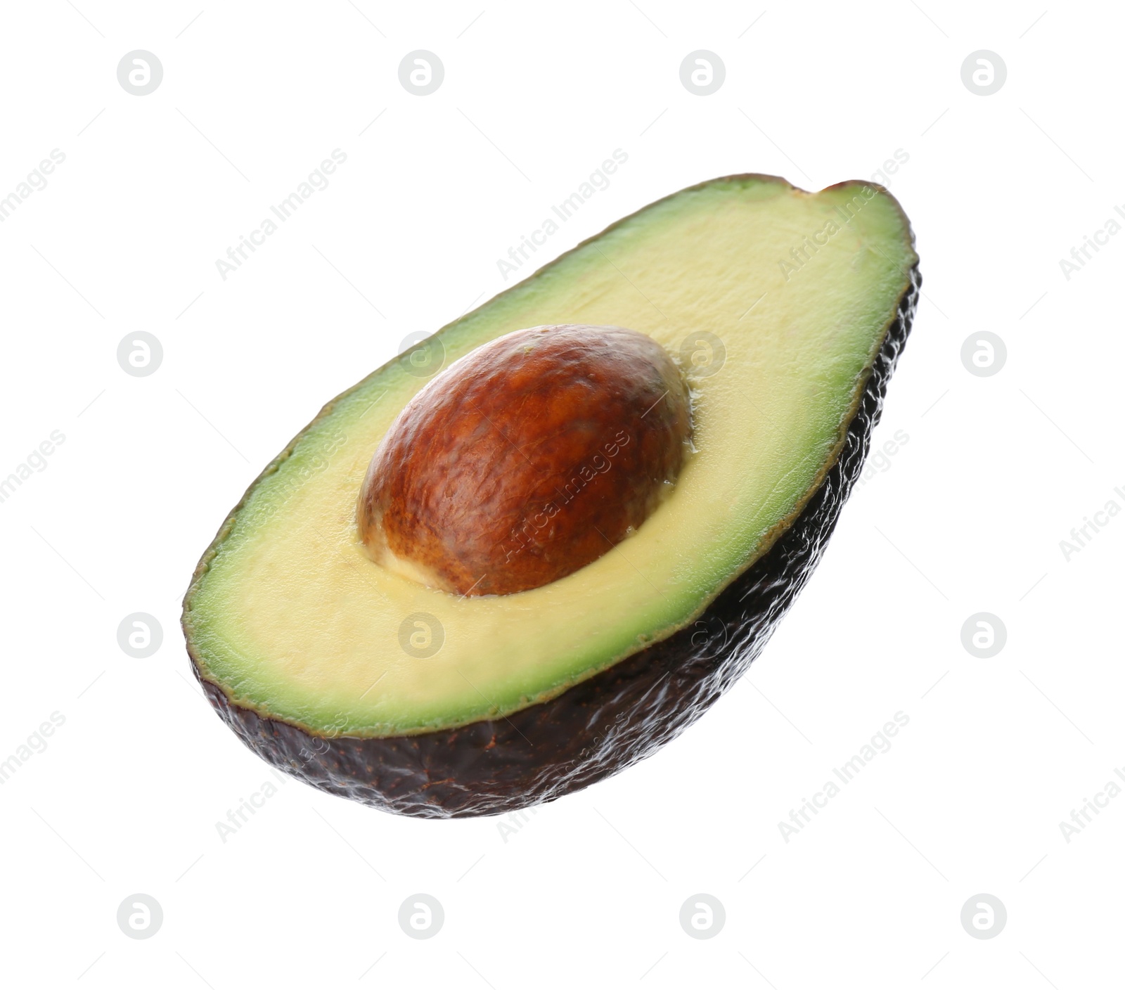 Photo of Half of ripe avocado with pit isolated on white