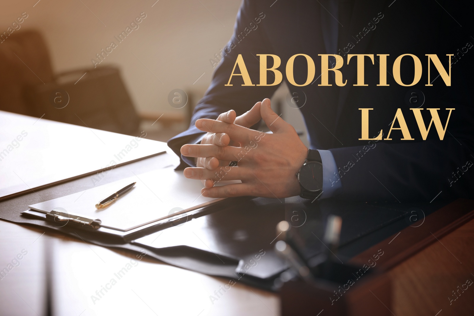 Image of Abortion law. Male lawyer at table in office, closeup