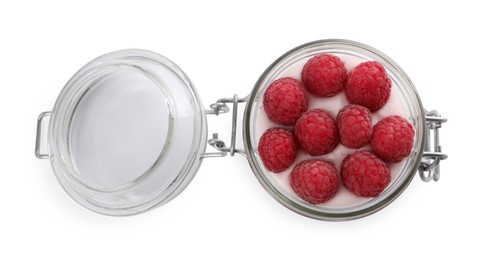 Photo of Jar of tasty yogurt with raspberries isolated on white, top view