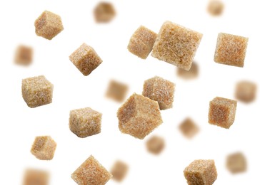 Image of Brown cane sugar cubes falling on white background