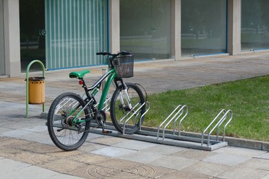 Photo of Metal bike parking rack with bicycle on city street