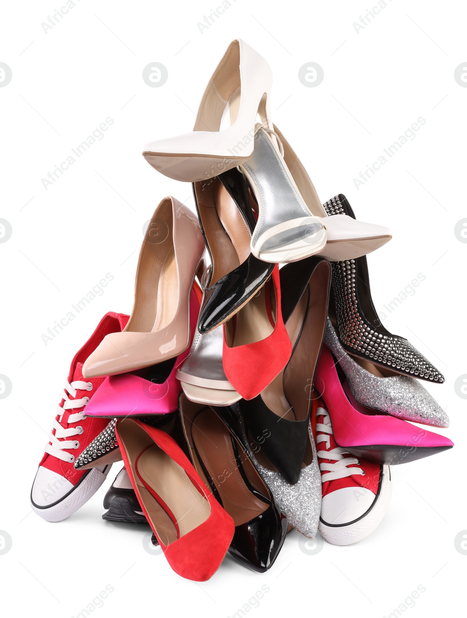 Photo of Pile of different female shoes isolated on white