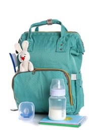 Maternity backpack with baby accessories on white background