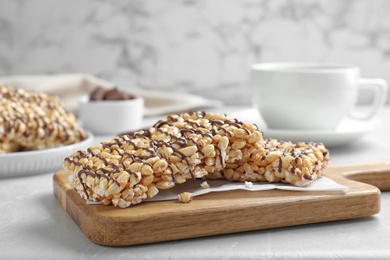 Photo of Delicious rice crispy treats on grey table