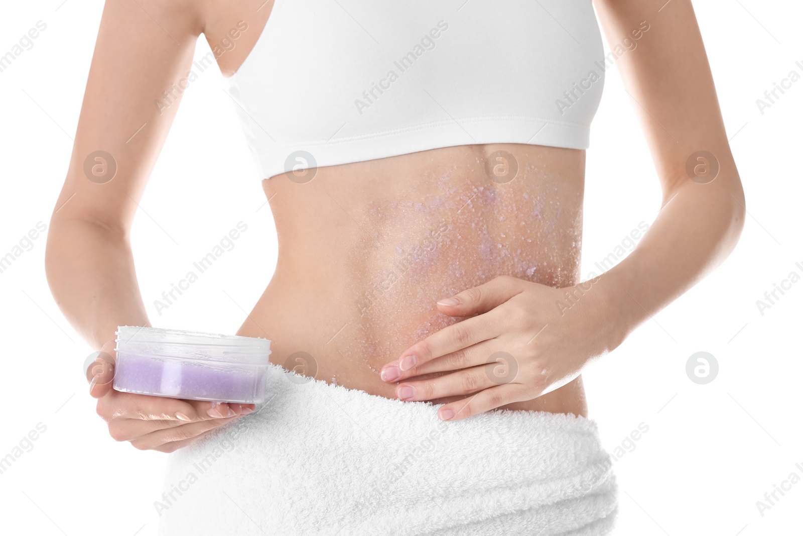 Photo of Young woman applying natural scrub on her belly against white background