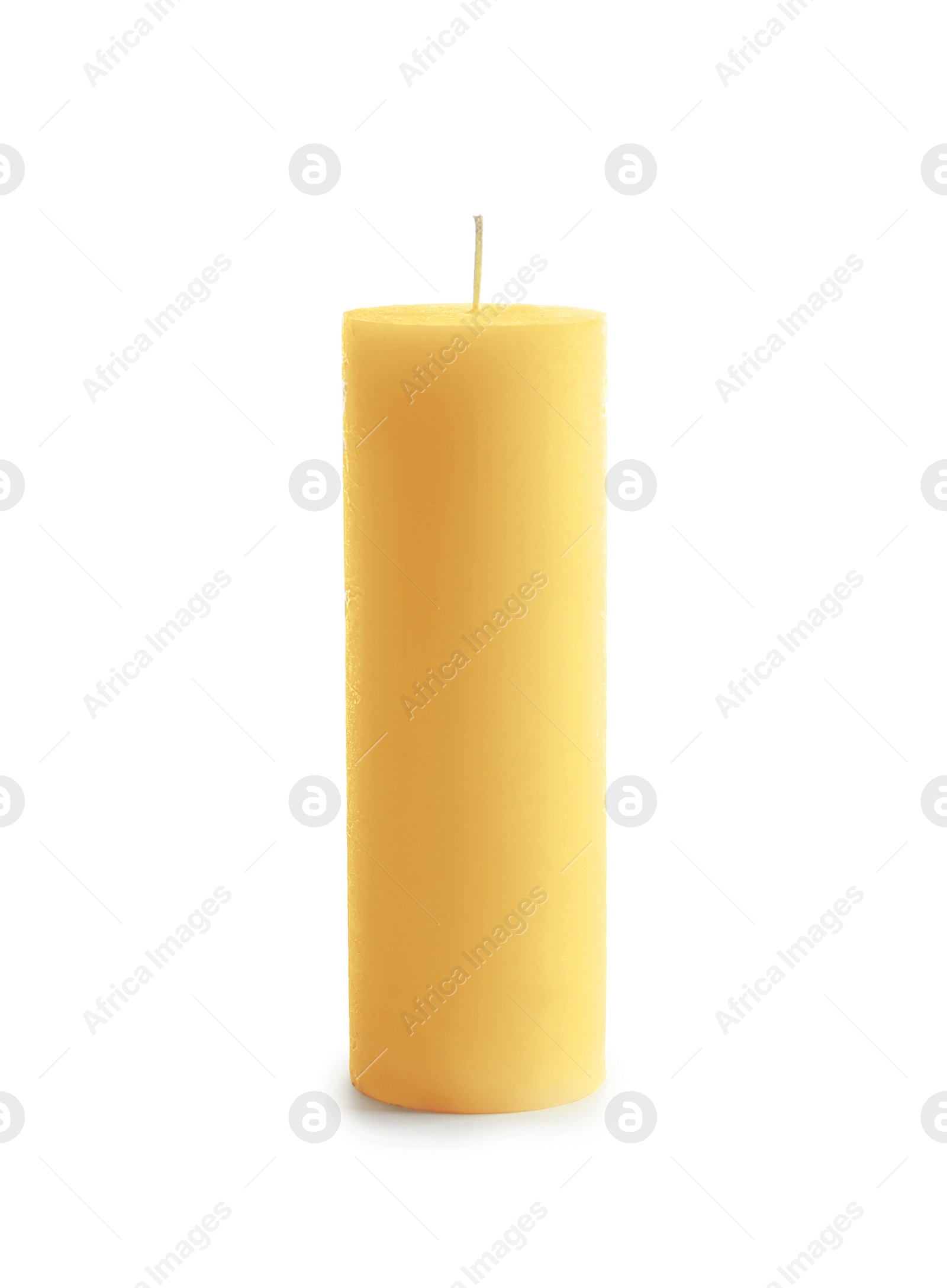 Photo of Yellow pillar wax candle on white background