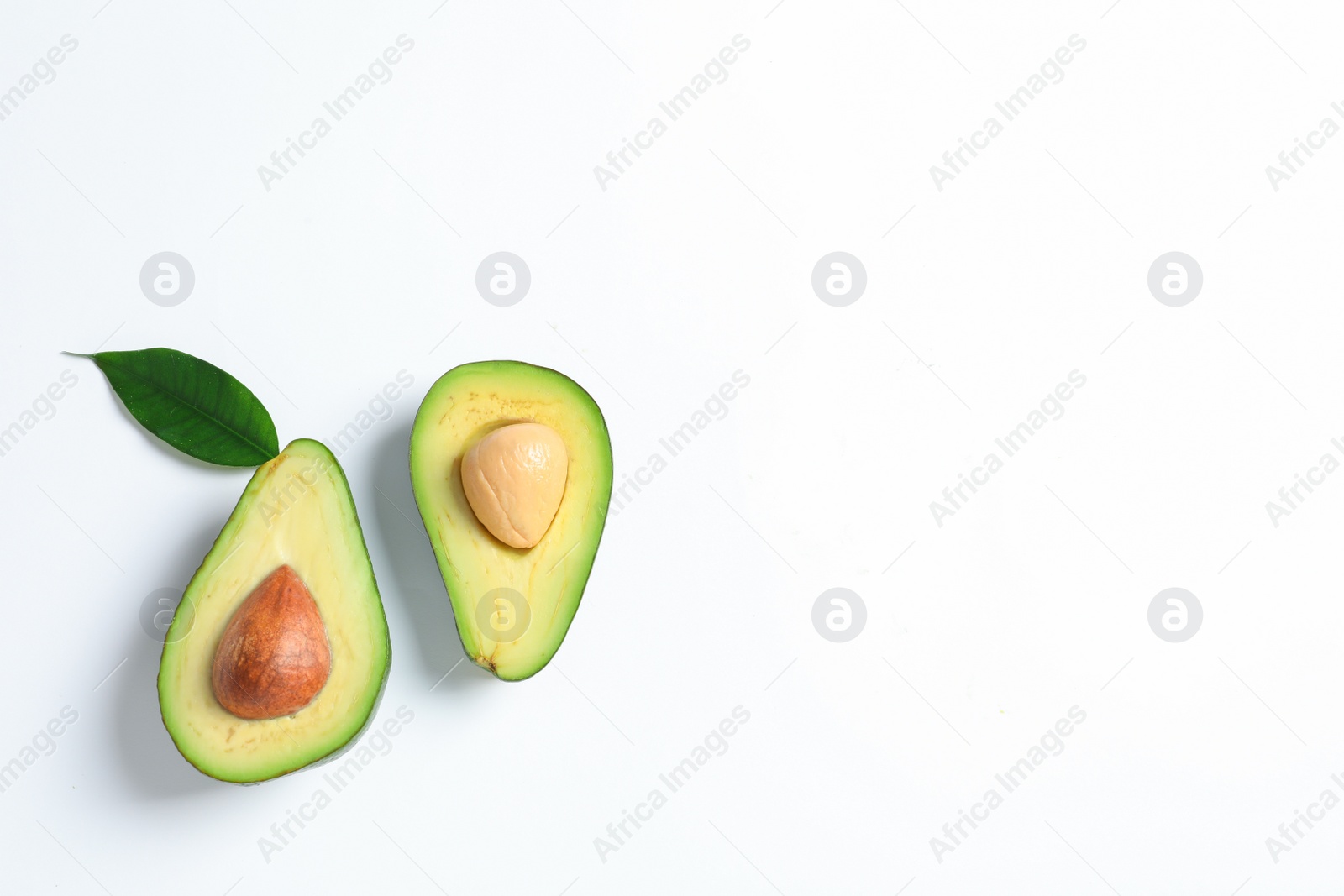 Photo of Ripe sliced avocado on white background