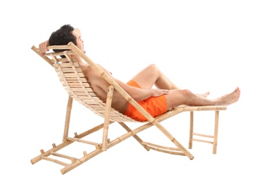 Photo of Young man on sun lounger against white background. Beach accessories