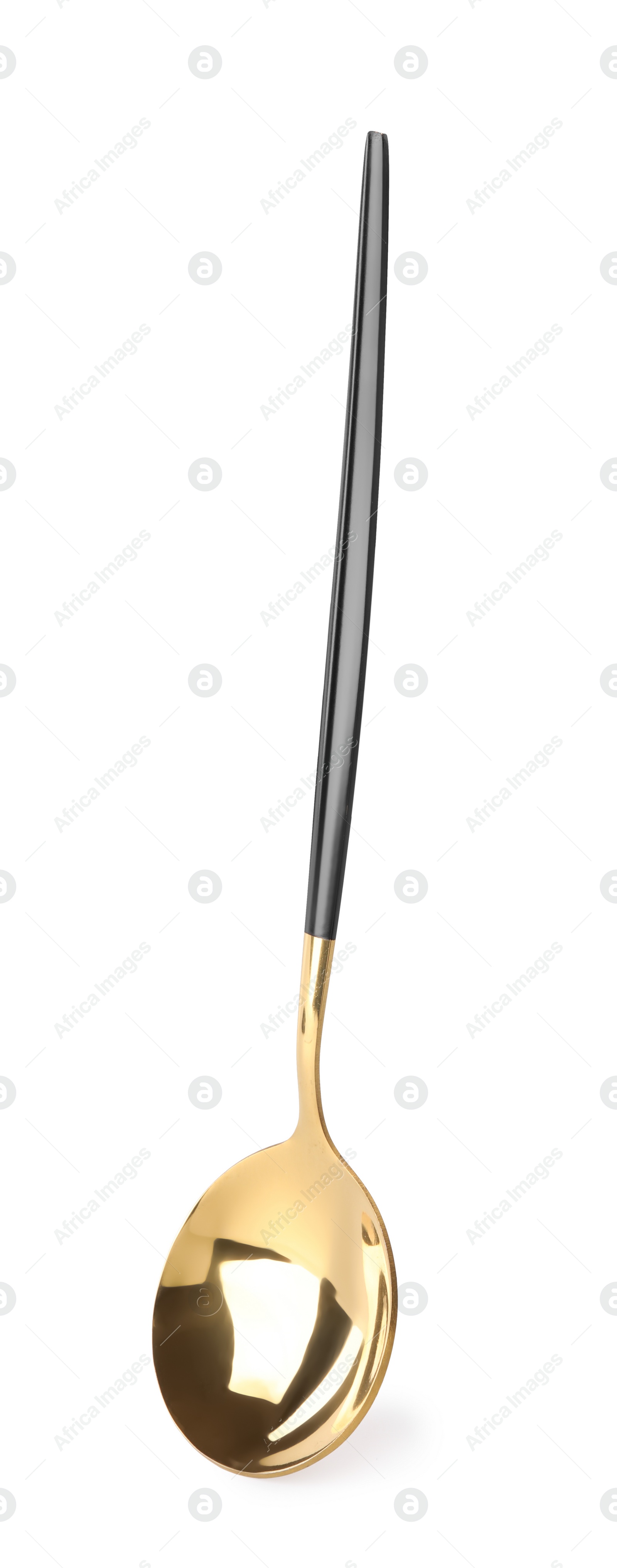 Photo of One shiny golden spoon isolated on white