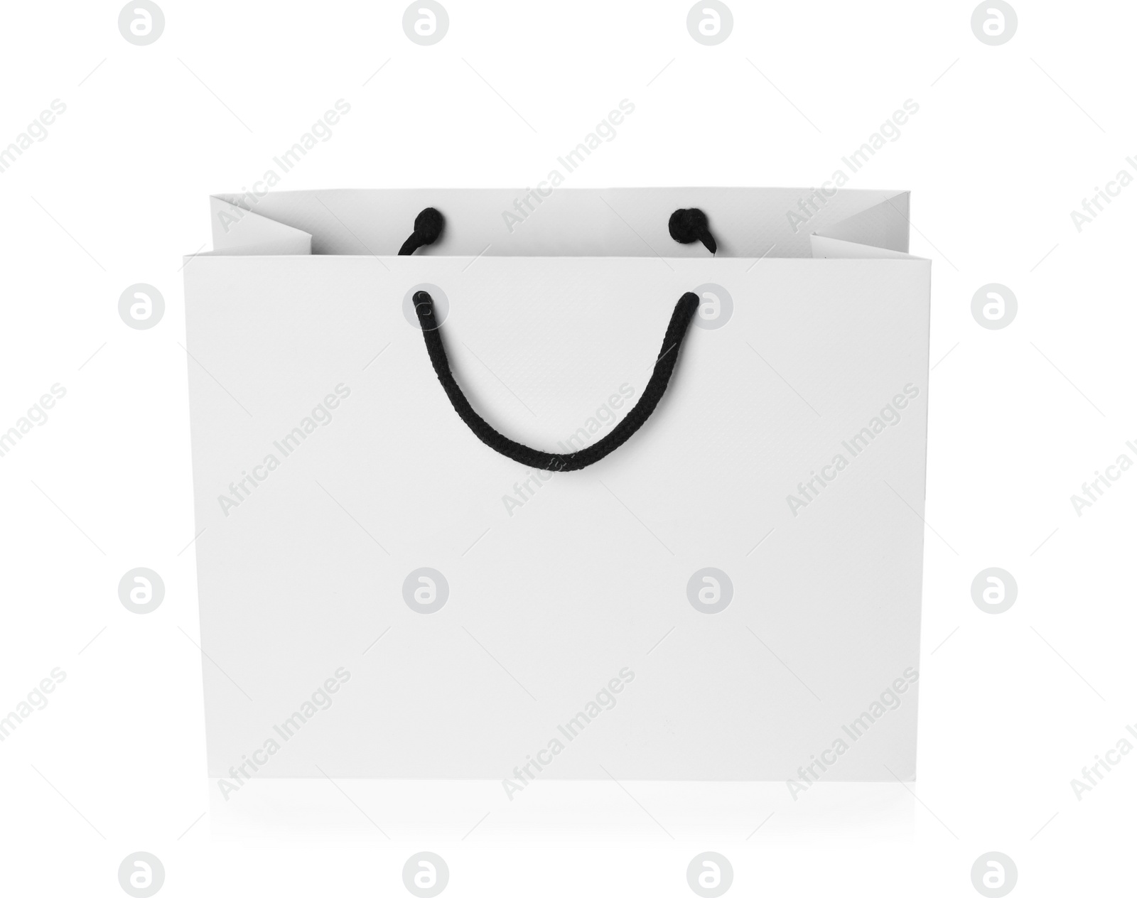 Photo of Paper shopping bag isolated on white. Mock up for design