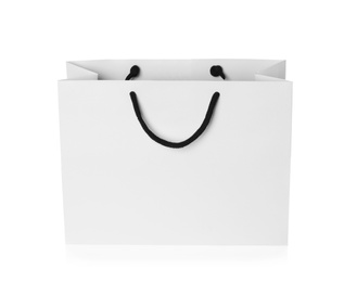 Photo of Paper shopping bag isolated on white. Mock up for design