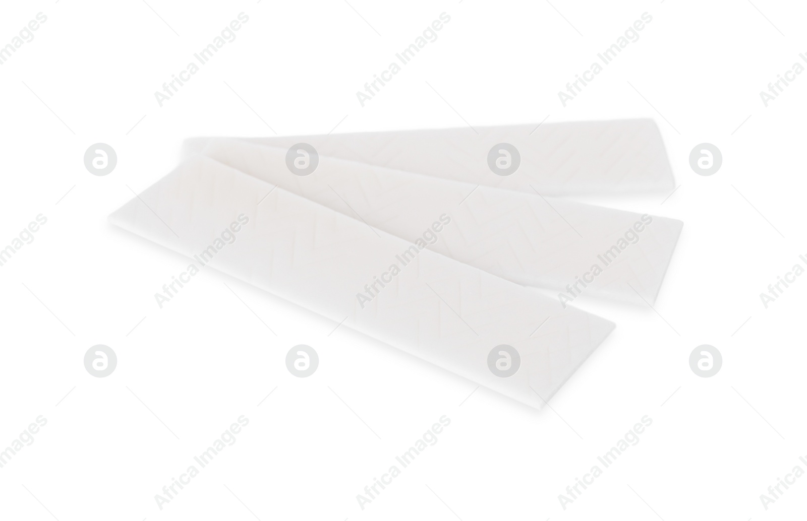 Photo of Sticks of tasty chewing gum isolated on white