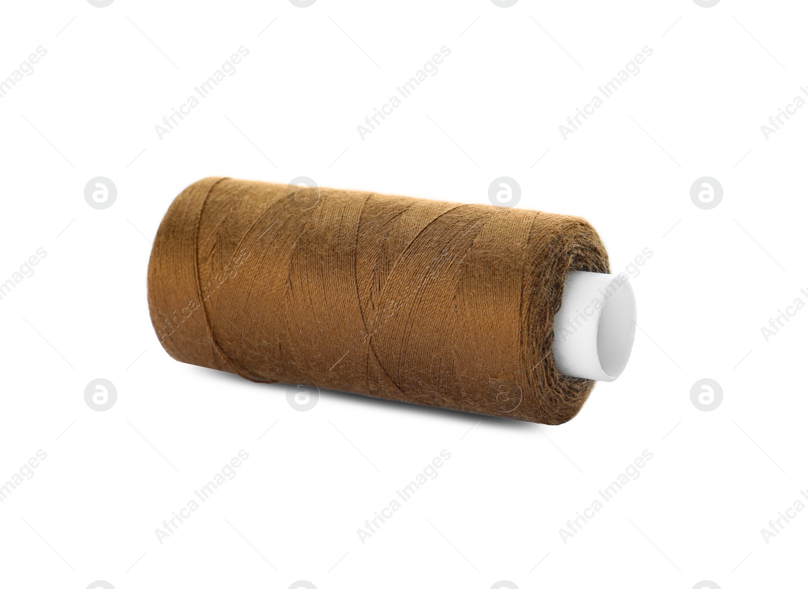 Photo of Spool of brown sewing thread isolated on white