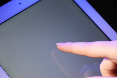 Woman using new modern tablet, closeup view