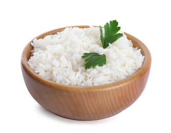 Photo of Wooden bowl with cooked rice and parsley isolated on white