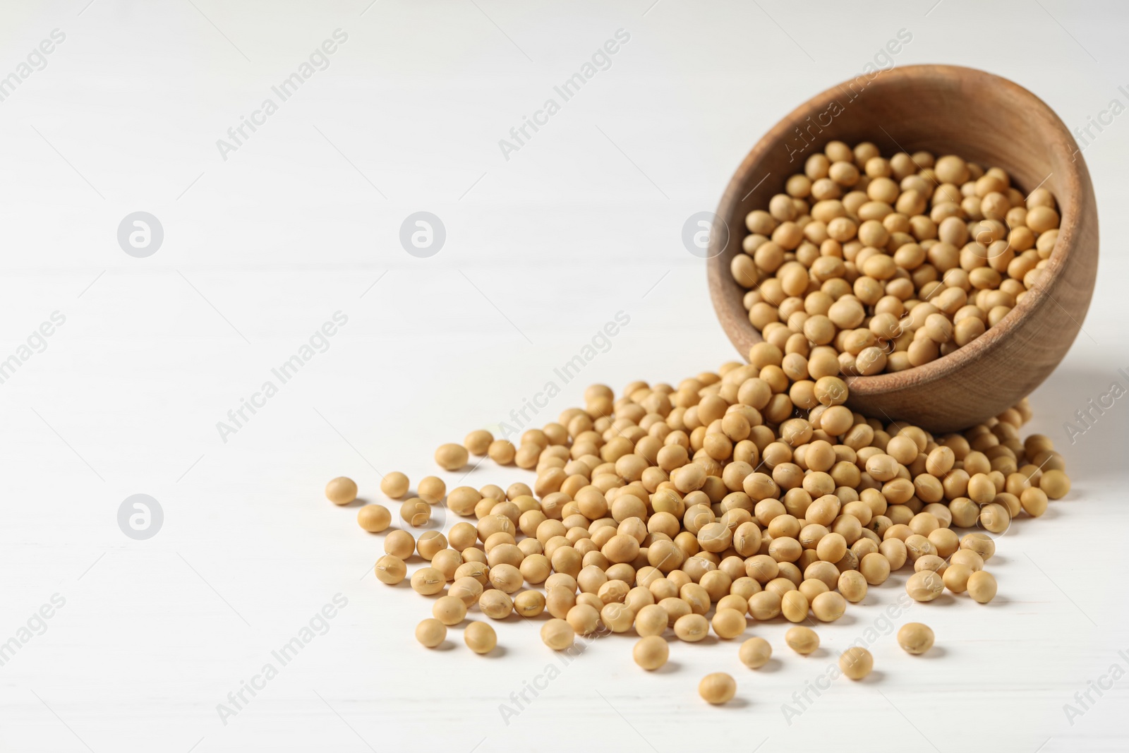 Photo of Soy and bowl on white table, space for text