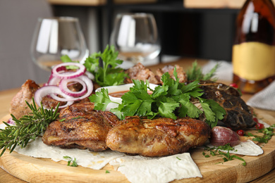 Photo of Delicious roasted chicken tobacco with herbal on wooden board, closeup