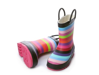 Photo of Colorful children's rubber boots on white background