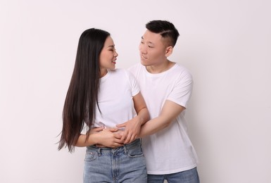 Portrait of happy couple on white background