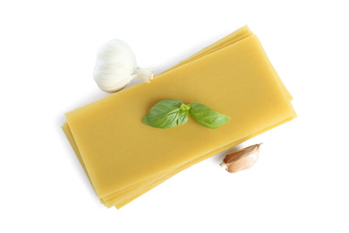 Composition with uncooked lasagna sheets on white background, top view