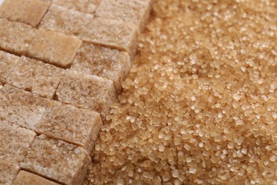 Photo of Different types of brown sugar as background, closeup. Space for text