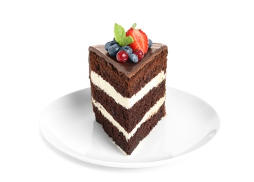 Plate with slice of chocolate sponge berry cake on white background