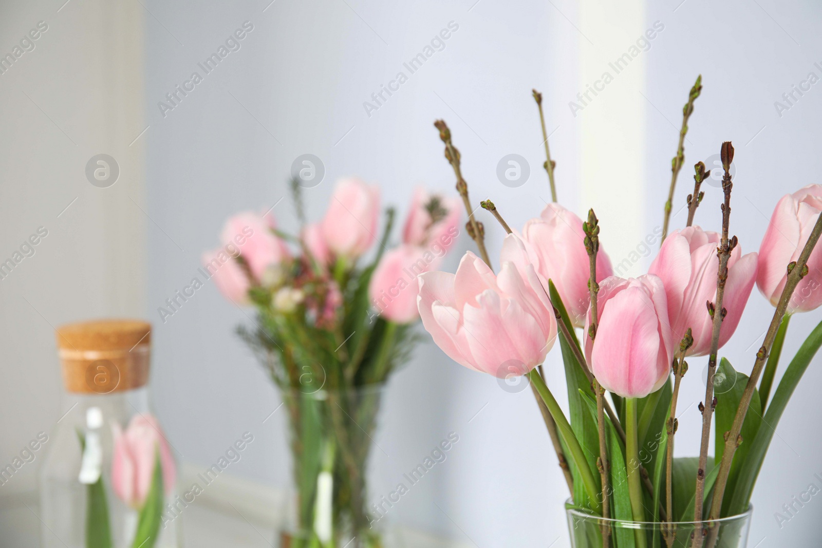 Photo of Beautiful bouquet of spring pink tulips on blurred background