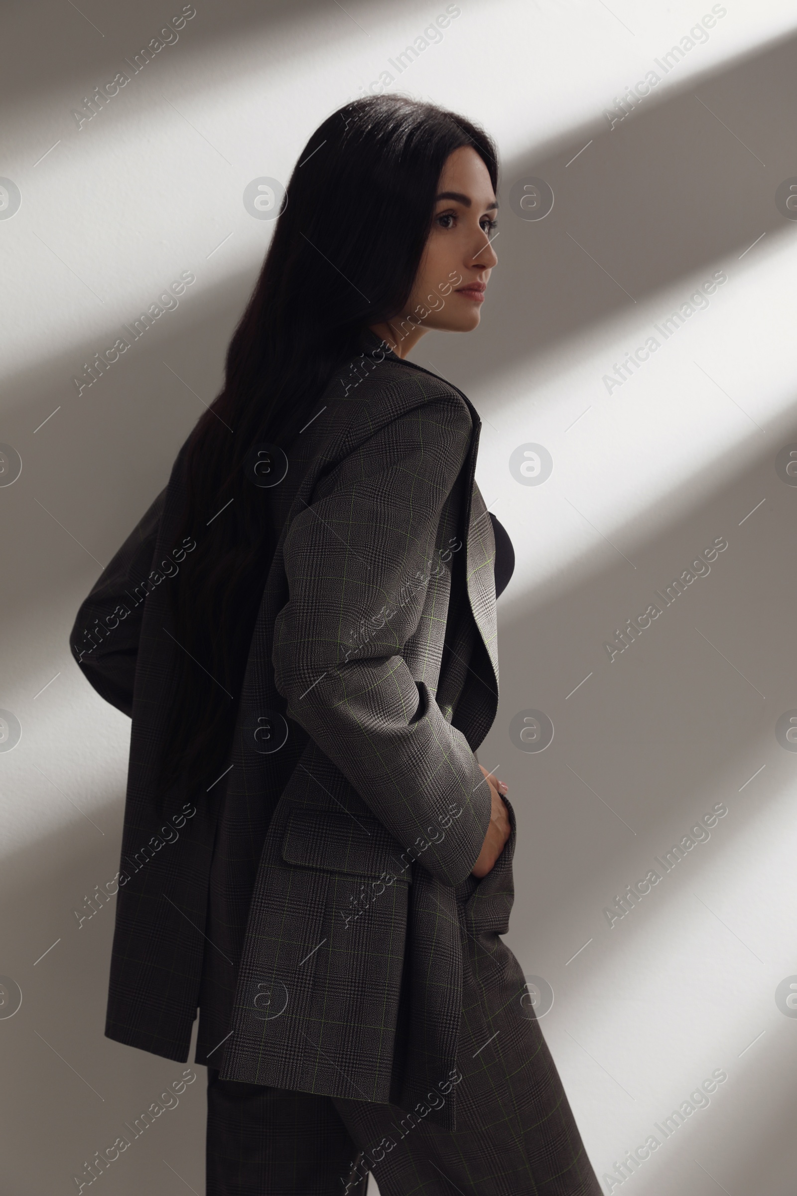 Photo of Beautiful woman in formal suit on white background. Business attire